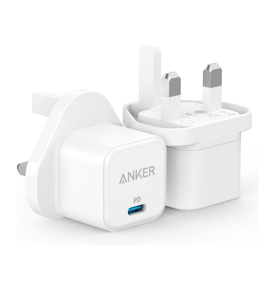 A top-down view of the Anker PowerPort III 20W Cube (white) lying flat on a surface, with a USB-C cable neatly coiled beside it. This highlights the charger's compact size and portability.