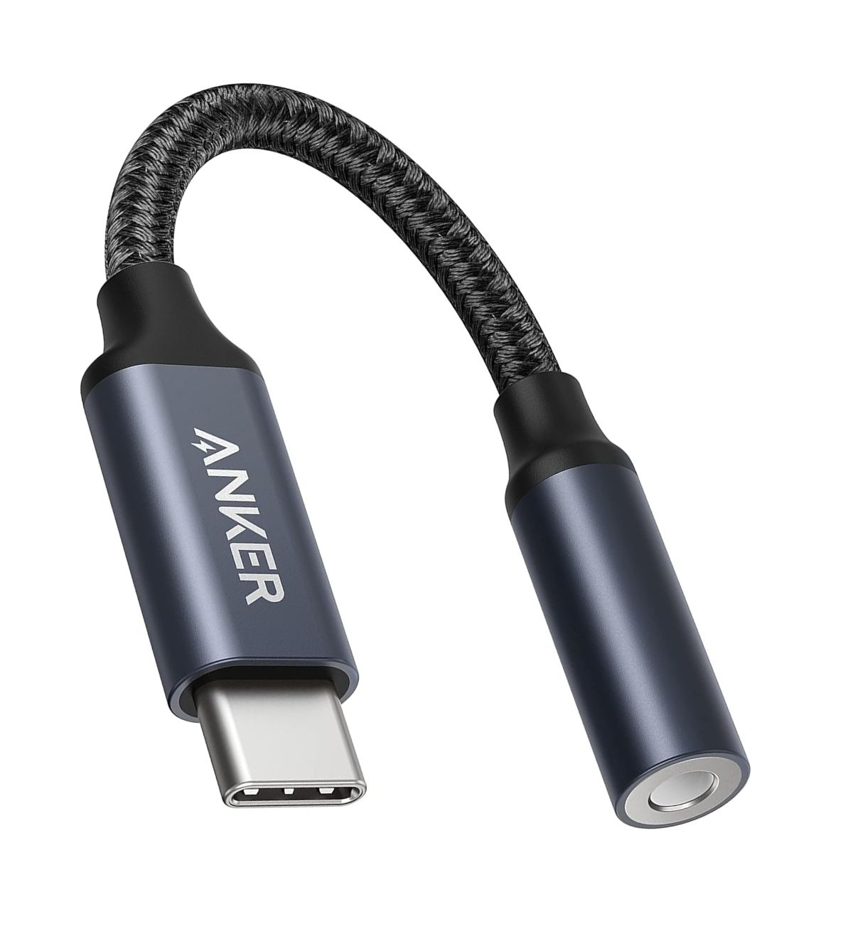 Close-up image of the Anker USB-C to 3.5mm Audio Adapter, highlighting the USB-C connector and the 3.5mm female headphone jack. Text overlay: "Connect your favorite 3.5mm headphones to your USB-C device (UK Compatible)